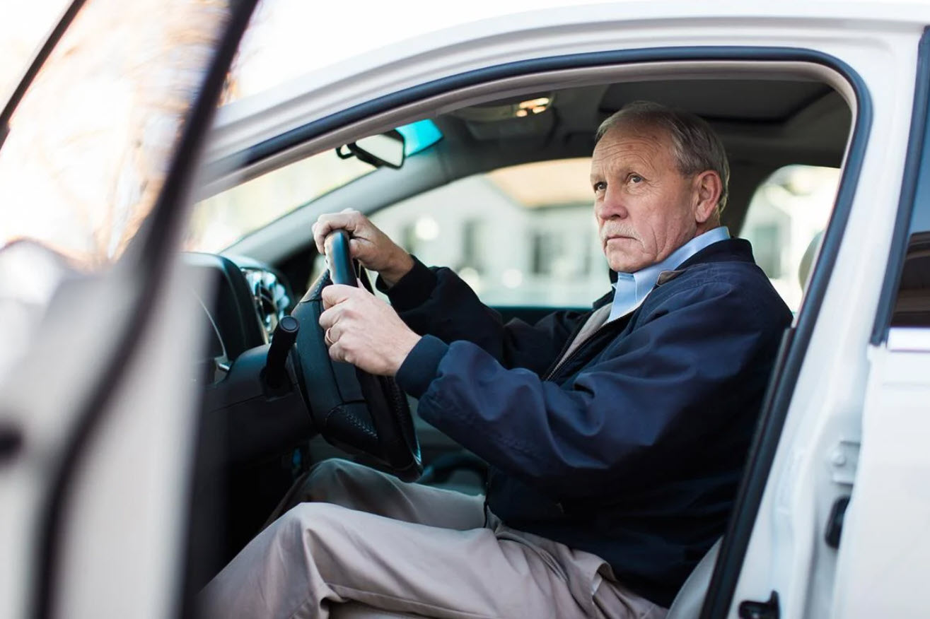 Senior man in a car