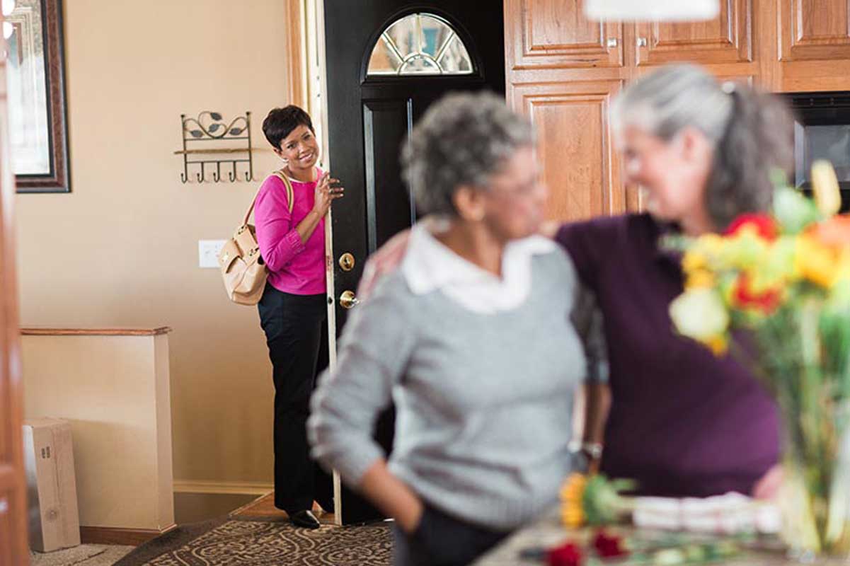 Daughter can take time for herself as a caregiver takes care of mom