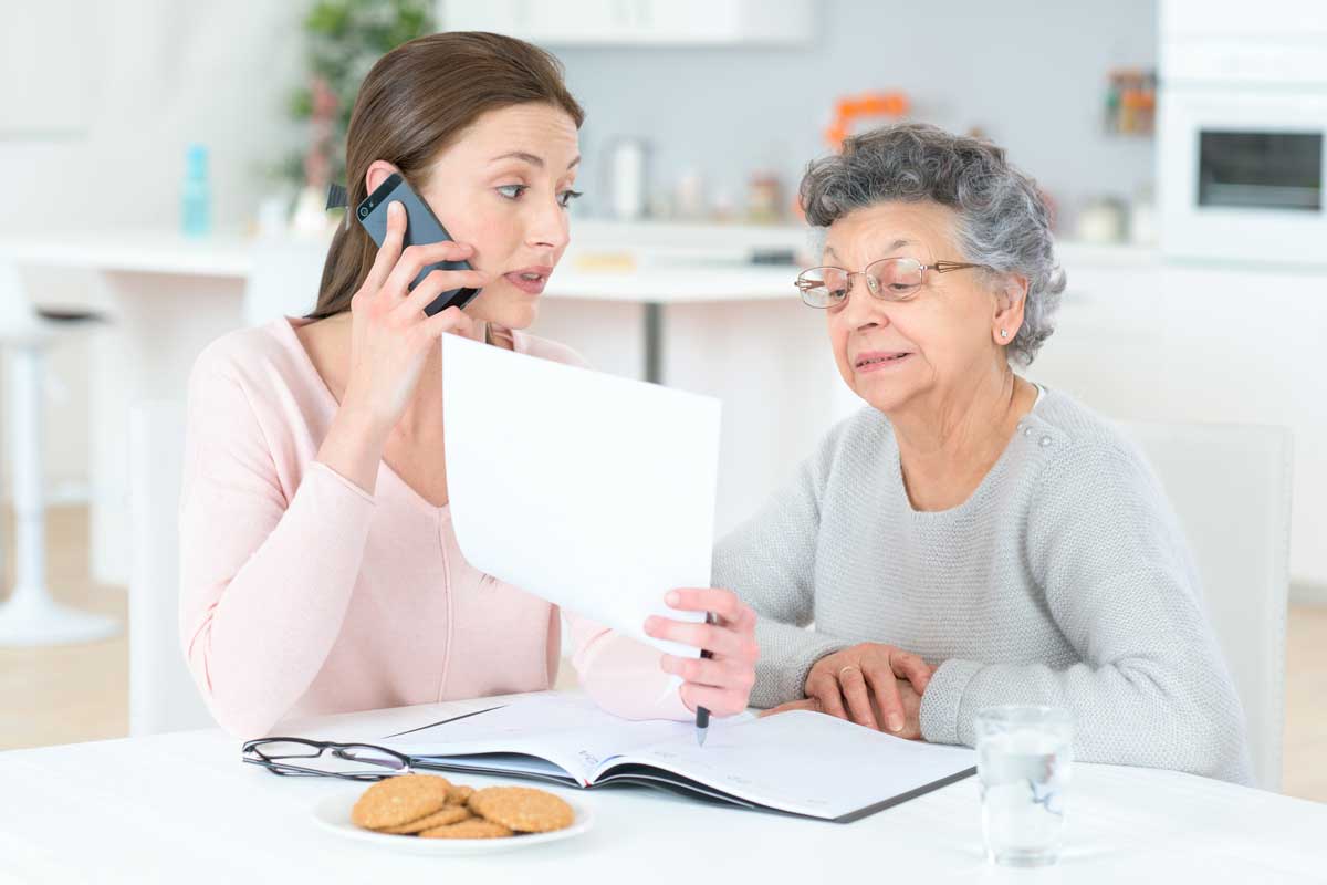 A daughter is helping her mother understand her finances