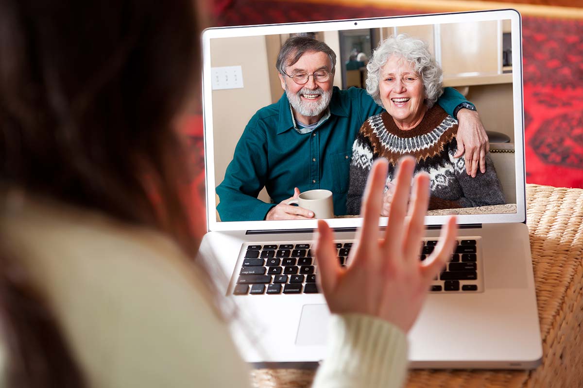 Seniors in a video conference with granddaughter via the Internet